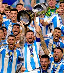 Lionel Messi lifts a trophy as Argentina celebrate