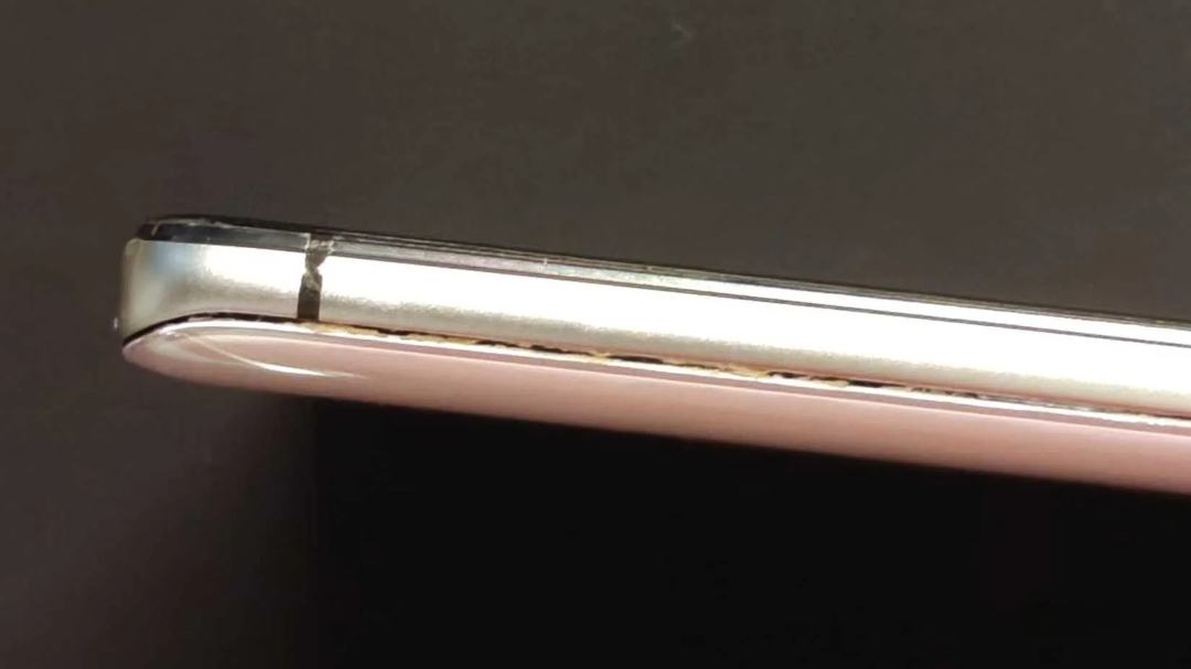Internal pressure from an overcharged phone battery causes it to rupture. image 1